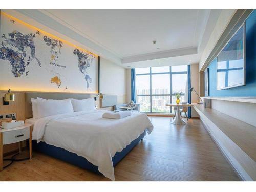 Imagen de la habitación del Hotel Kyriad Marvelous Heyuan Wanlong City. Foto 12