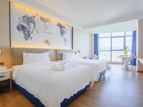 Imagen de la habitación del Hotel Kyriad Marvelous Heyuan Wanlong City. Foto 14
