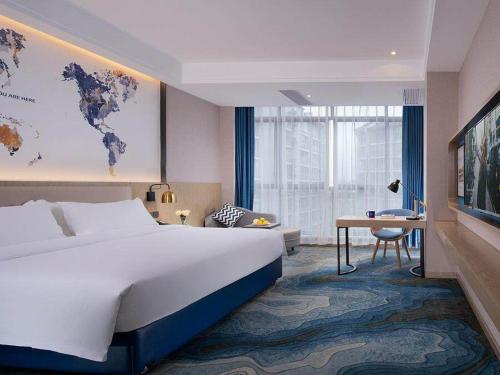 Imagen de la habitación del Hotel Kyriad Marvelous Hezhou Wanda Plaza. Foto 17