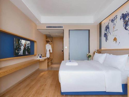 Imagen de la habitación del Hotel Kyriad Marvelous Huizhou Boluo Longxi. Foto 19