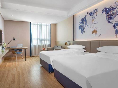 Imagen de la habitación del Hotel Kyriad Marvelous Huizhou Boluo Yuanzhou. Foto 14