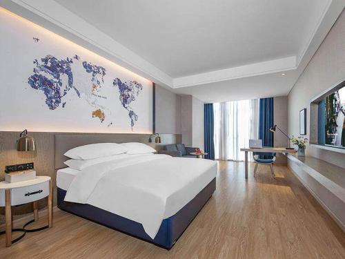 Imagen de la habitación del Hotel Kyriad Marvelous Huizhou Boluo Yuanzhou. Foto 17