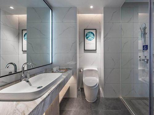 Imagen de la habitación del Hotel Kyriad Marvelous Huizhou Boluo Yuanzhou. Foto 18