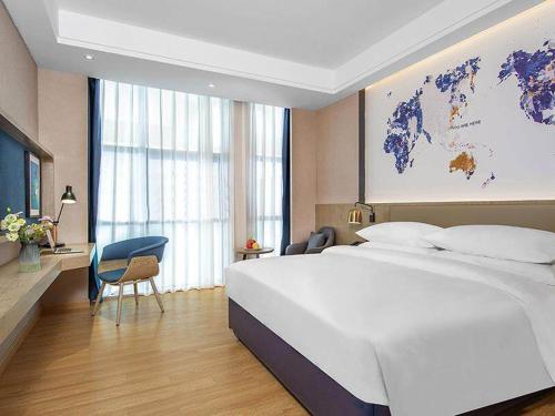 Imagen de la habitación del Hotel Kyriad Marvelous Huizhou Boluo Yuanzhou. Foto 19