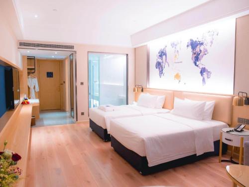 Imagen de la habitación del Hotel Kyriad Marvelous Luoding Ring City East Road. Foto 18