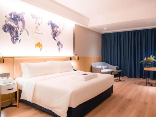 Imagen de la habitación del Hotel Kyriad Marvelous Luoding Ring City East Road. Foto 19