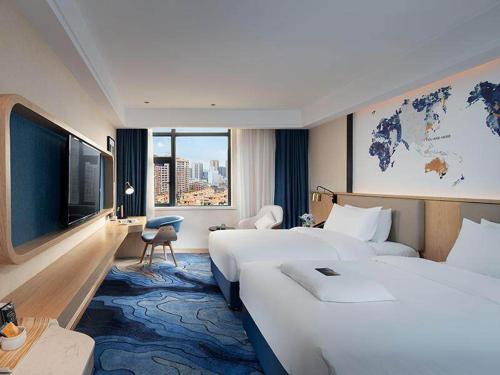 Imagen de la habitación del Hotel Kyriad Marvelous Maoming Dianbai Wanda Plaza. Foto 13