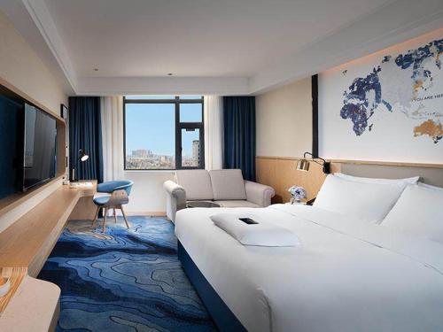 Imagen de la habitación del Hotel Kyriad Marvelous Maoming Dianbai Wanda Plaza. Foto 14
