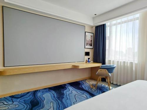 Imagen de la habitación del Hotel Kyriad Marvelous Maoming Dianbai Wanda Plaza. Foto 15