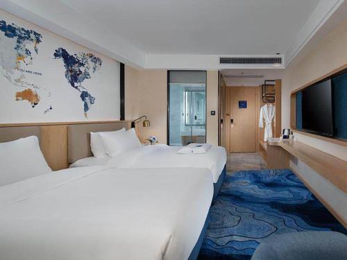 Imagen de la habitación del Hotel Kyriad Marvelous Maoming Dianbai Wanda Plaza. Foto 17