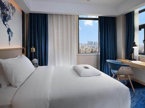 Imagen de la habitación del Hotel Kyriad Marvelous Maoming Dianbai Wanda Plaza. Foto 20