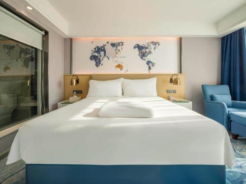 Imagen de la habitación del Hotel Kyriad Marvelous Qingyuan City Square. Foto 12