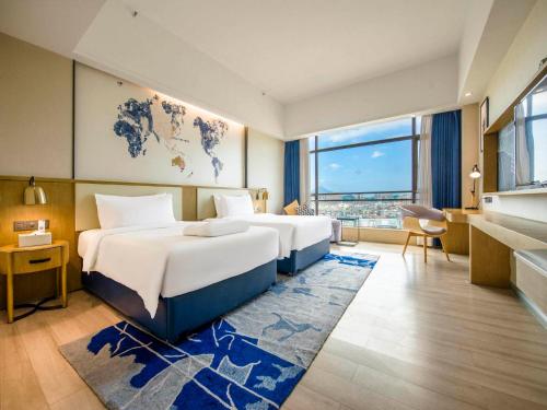 Imagen de la habitación del Hotel Kyriad Marvelous Qingyuan City Square. Foto 13