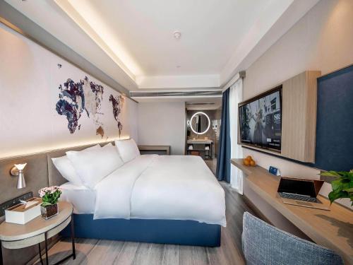 Imagen de la habitación del Hotel Kyriad Marvelous Qinhuangdao Nandaihe. Foto 15