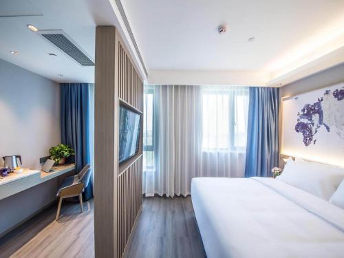 Imagen de la habitación del Hotel Kyriad Marvelous Qinhuangdao Nandaihe. Foto 16