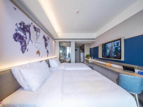Imagen de la habitación del Hotel Kyriad Marvelous Qinhuangdao Nandaihe. Foto 17