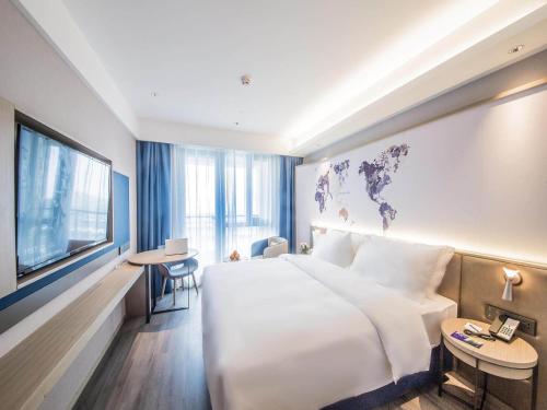 Imagen de la habitación del Hotel Kyriad Marvelous Qinhuangdao Nandaihe. Foto 18