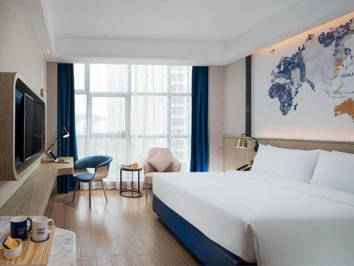 Imagen de la habitación del Hotel Kyriad Marvelous Shenzhen Longgang Dayun City Center. Foto 8