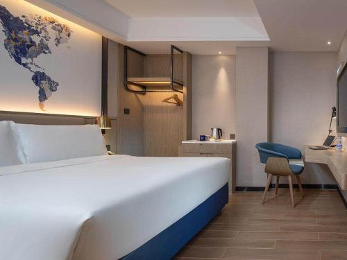 Imagen de la habitación del Hotel Kyriad Marvelous Shenzhen Longgang Dayun City Center. Foto 9