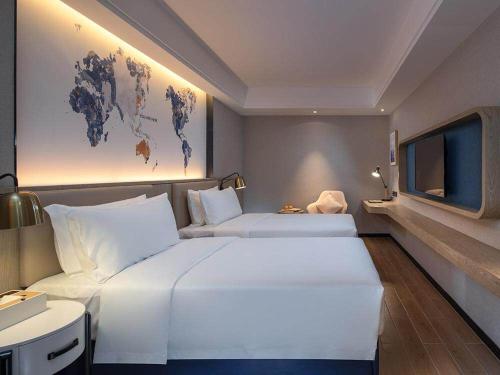 Imagen de la habitación del Hotel Kyriad Marvelous Shenzhen Longgang Dayun City Center. Foto 11