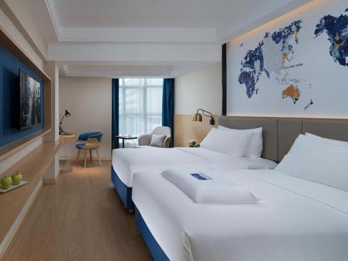 Imagen de la habitación del Hotel Kyriad Marvelous Shenzhen Longgang Dayun City Center. Foto 12