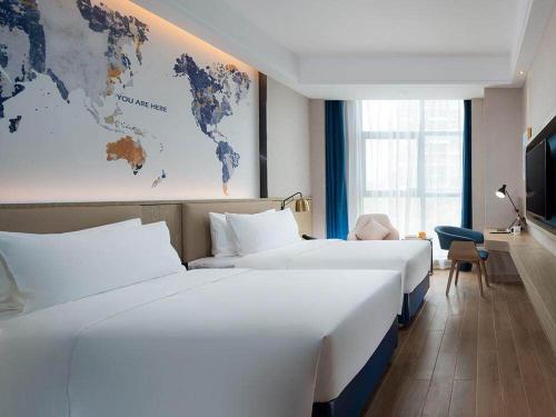 Imagen de la habitación del Hotel Kyriad Marvelous Shenzhen Longgang Dayun City Center. Foto 13