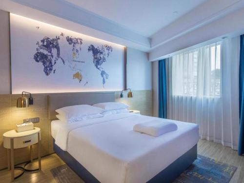 Imagen de la habitación del Hotel Kyriad Marvelous Shenzhen Longgang Dayun City Center. Foto 14