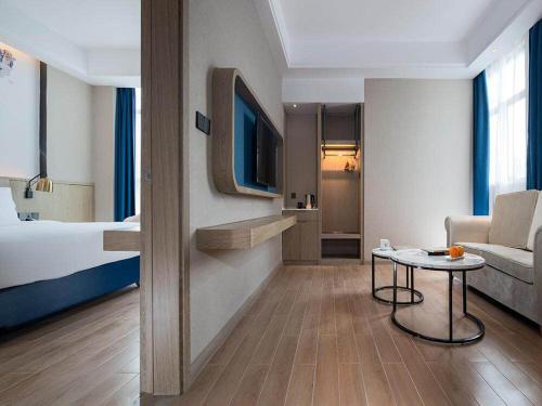 Imagen de la habitación del Hotel Kyriad Marvelous Shenzhen Longgang Dayun City Center. Foto 15