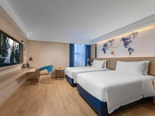 Imagen de la habitación del Hotel Kyriad Marvelous Shenzhen Nanlian Metro Station. Foto 16