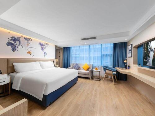 Imagen de la habitación del Hotel Kyriad Marvelous Shenzhen Nanlian Metro Station. Foto 17