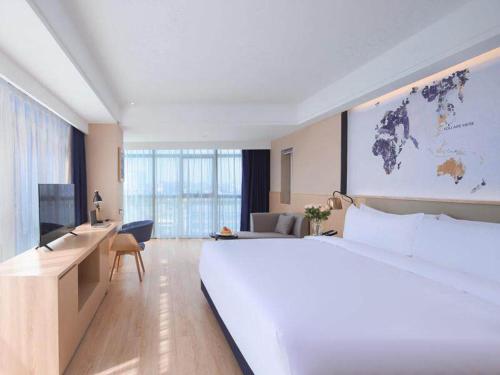 Imagen de la habitación del Hotel Kyriad Marvelous Suzhou Wujiang People Square. Foto 14