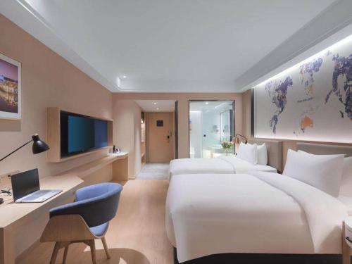 Imagen de la habitación del Hotel Kyriad Marvelous Suzhou Wujiang People Square. Foto 17