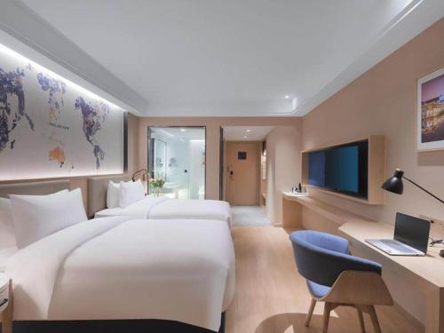 Imagen de la habitación del Hotel Kyriad Marvelous Suzhou Wujiang People Square. Foto 19