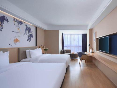 Imagen general del Hotel Kyriad Marvelous Suzhou Wujiang People Square. Foto 9