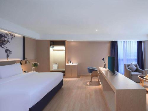 Imagen general del Hotel Kyriad Marvelous Suzhou Wujiang People Square. Foto 12