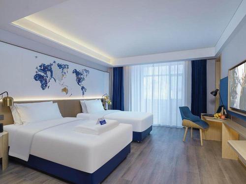 Imagen de la habitación del Hotel Kyriad Marvelous Weihai Happy Gate Weigao Plaza. Foto 13