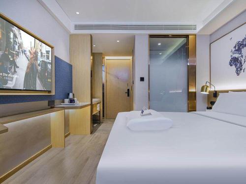 Imagen general del Hotel Kyriad Marvelous Weihai Happy Gate Weigao Plaza. Foto 6