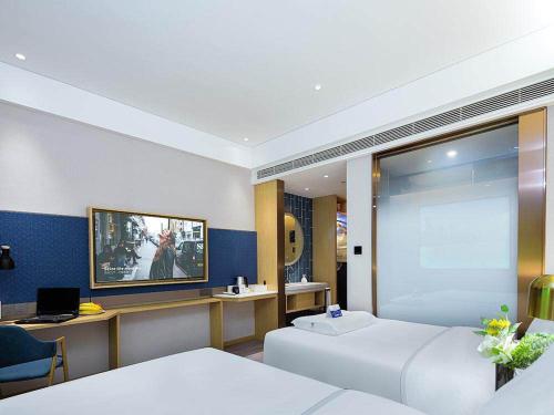 Imagen general del Hotel Kyriad Marvelous Weihai Happy Gate Weigao Plaza. Foto 9