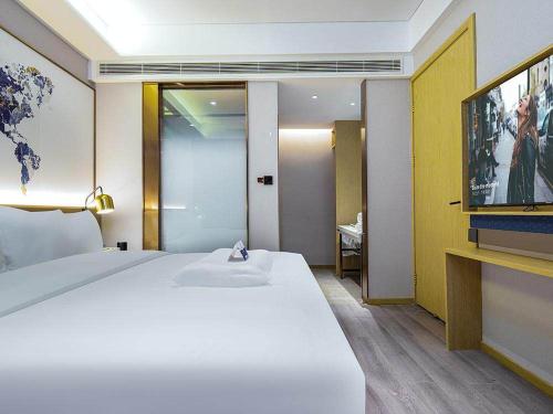 Imagen general del Hotel Kyriad Marvelous Weihai Happy Gate Weigao Plaza. Foto 11