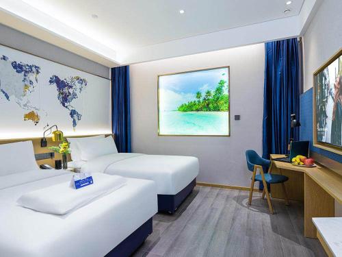 Imagen de la habitación del Hotel Kyriad Marvelous Weihai Happy Gate Weigao Plaza. Foto 18