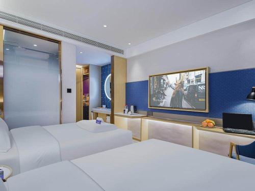 Imagen de la habitación del Hotel Kyriad Marvelous Weihai Happy Gate Weigao Plaza. Foto 19