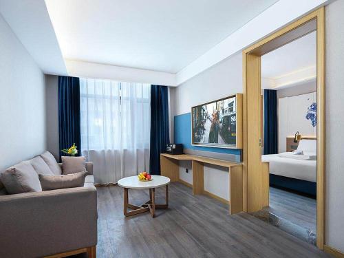 Imagen de la habitación del Hotel Kyriad Marvelous Weihai Happy Gate Weigao Plaza. Foto 20