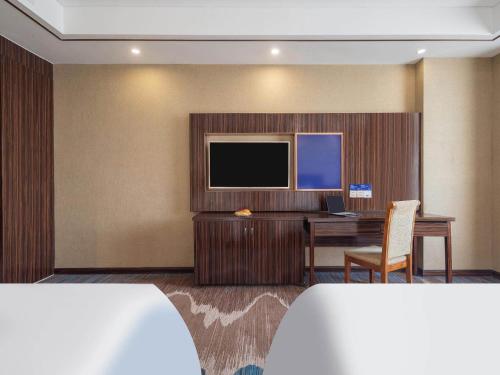 Imagen de la habitación del Hotel Kyriad Marvelous Weihai Railway Station. Foto 16