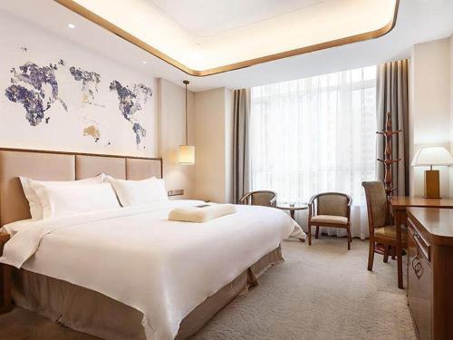 Imagen de la habitación del Hotel Kyriad Marvelous Weihai Railway Station. Foto 18