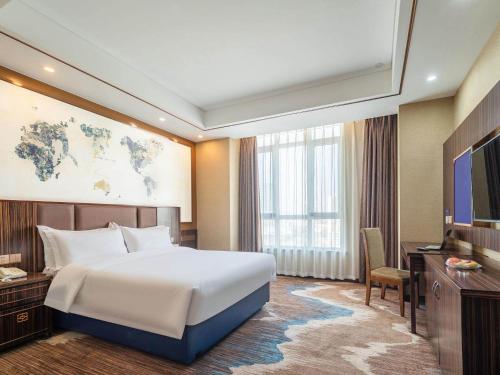 Imagen de la habitación del Hotel Kyriad Marvelous Weihai Railway Station. Foto 20