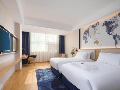 Imagen de la habitación del Hotel Kyriad Marvelous Yiyang Ziyang. Foto 15