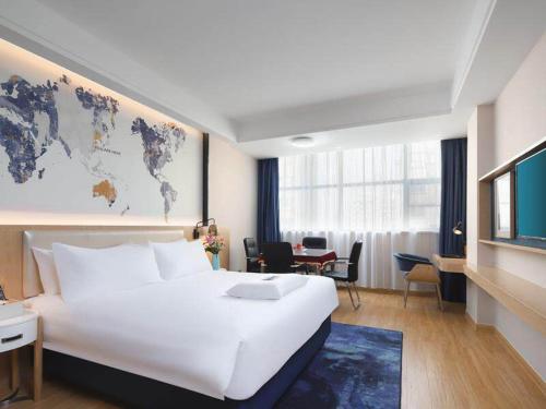 Imagen de la habitación del Hotel Kyriad Marvelous Yiyang Ziyang. Foto 20