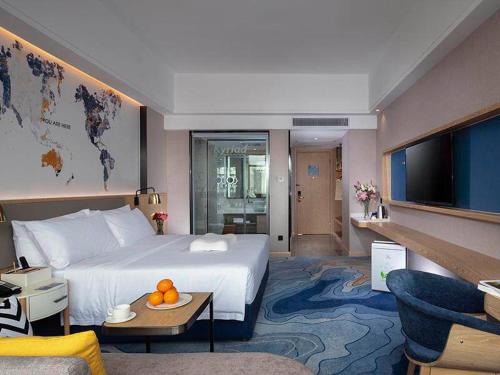 Imagen de la habitación del Hotel Kyriad Marvelous Zhongshan Nanlang Center. Foto 8