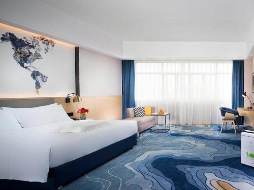 Imagen de la habitación del Hotel Kyriad Marvelous Zhongshan Nanlang Center. Foto 10