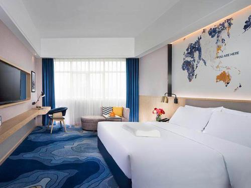 Imagen de la habitación del Hotel Kyriad Marvelous Zhongshan Nanlang Center. Foto 11